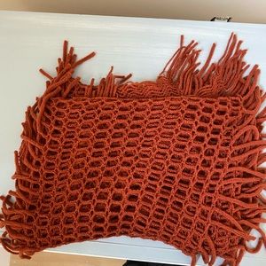 Orange-reddish knit scarf